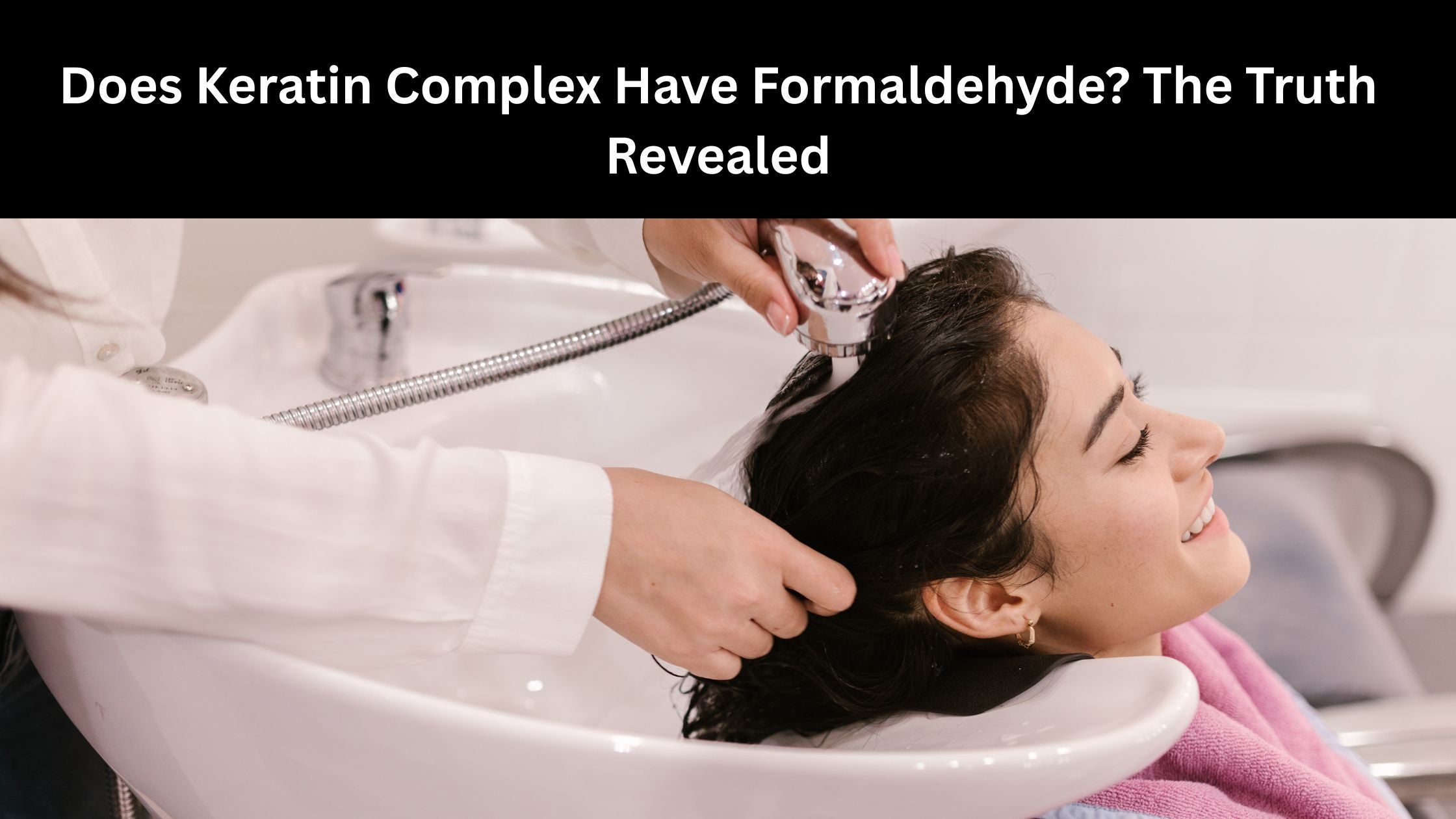 Woman getting her hair washed at a salon sink
