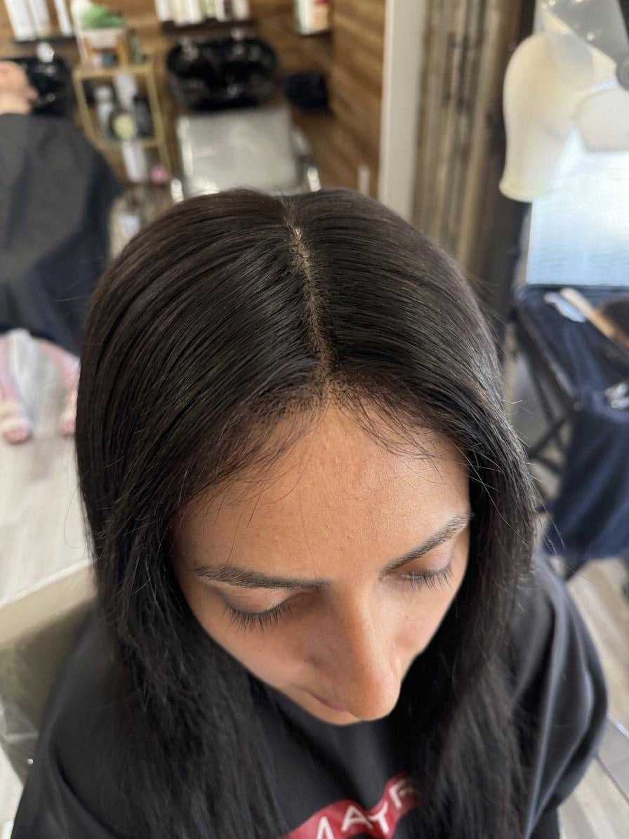 woman wearing a natural hair topper Noelle Salon Boston