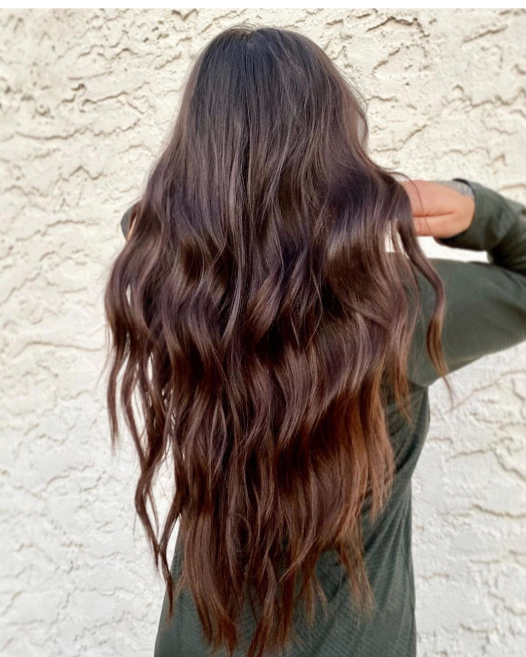arm golden blonde balayage with dimensional waves.