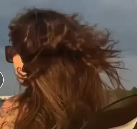 hair extensions showing in a person's hair