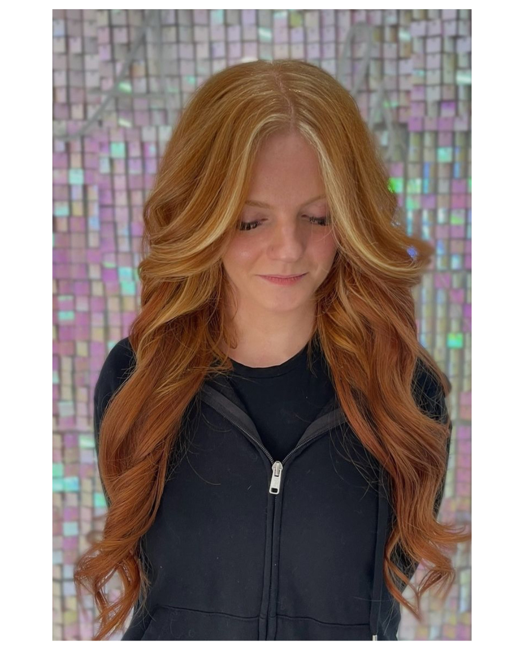 woman with a long layered haircut at Noelle Salon
